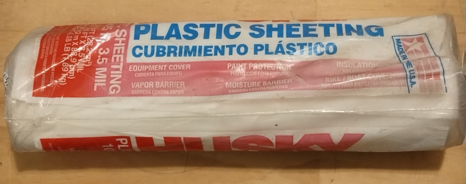 Husky 3.5 Mil Clear Plastic Sheeting roll, measuring 10 feet by 25 feet